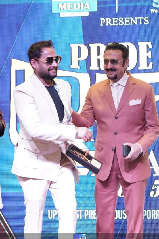 Aspire Kingdom Consultant Abhieshek Katiyaar receiving award from Bollywood actor Gulshan Grover at Pride Awards event